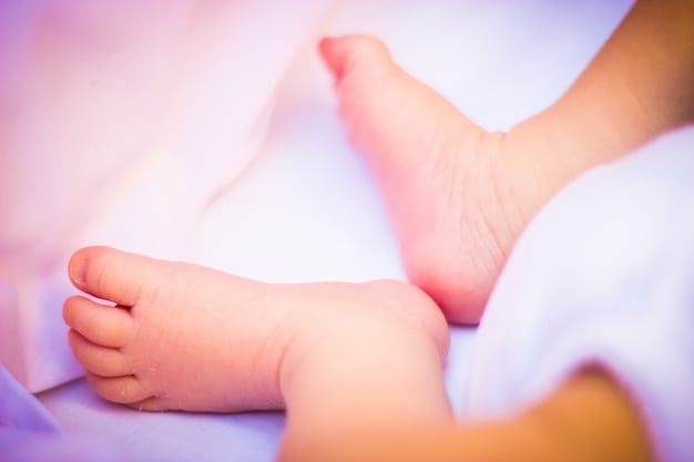 Tiny Toes Resting on Soft Fabric